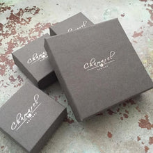 Load image into Gallery viewer, Chamarel Designs gift boxes for our jewellery are grey in colour with our logo on the top in silver foil.
