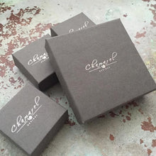 Load image into Gallery viewer, Chamarel Designs gift boxes for our jewellery are grey in colour with our logo on the top in silver foil.