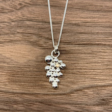 Load image into Gallery viewer, Sterling silver pendant offset with a singular 9ct gold bead. The pendant sits on a sterling silver curb chain and has a high polished finish.
